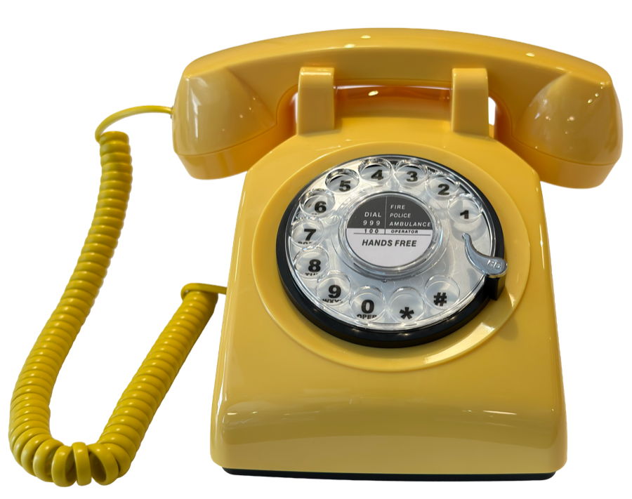 A yellow rotary telephone. Tap it to call Matt.